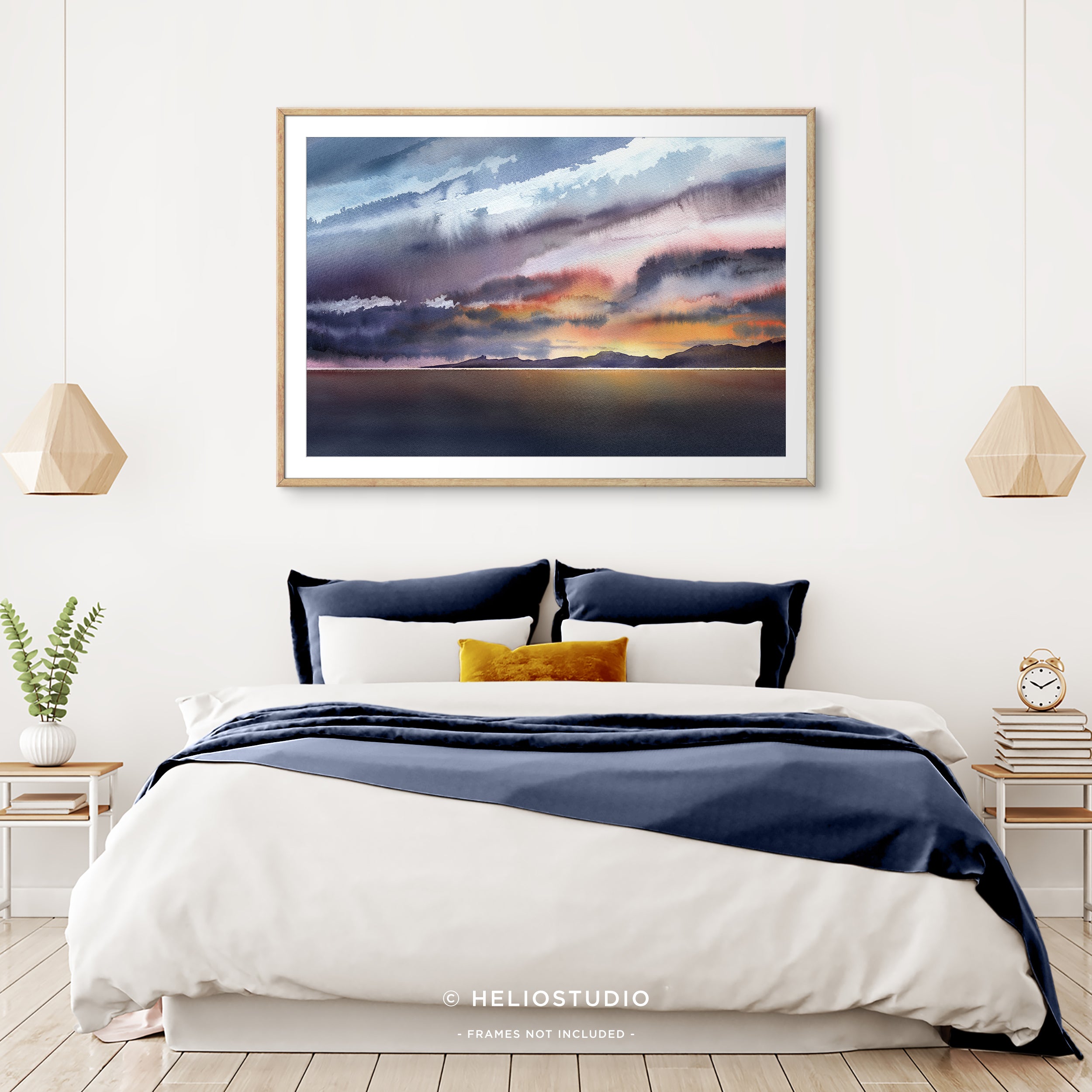 colourful watercolour sunset in wooden frame with white mount in sunny bedroom