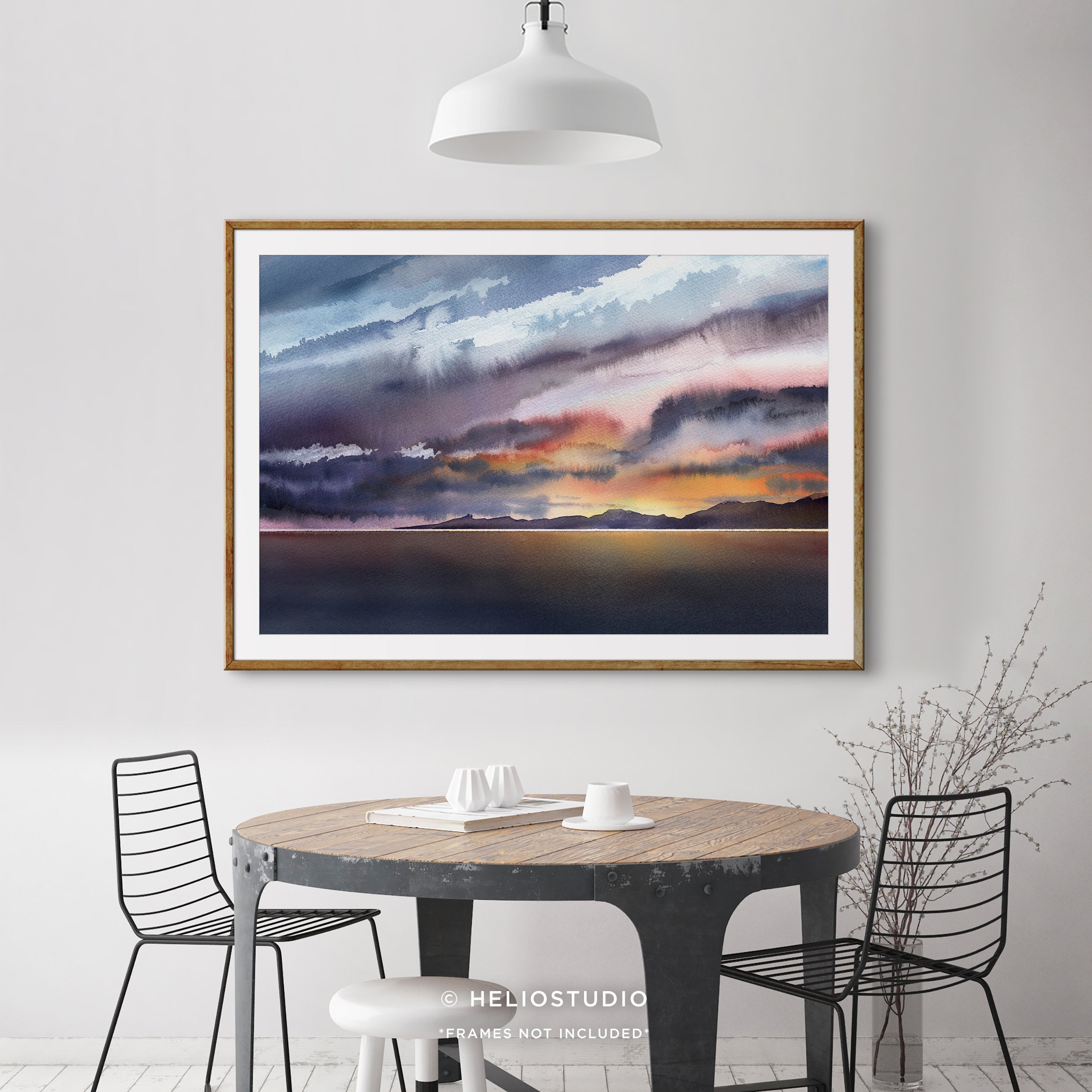 colourful watercolour sunset in wooden frame with white mount in industrial style dining room