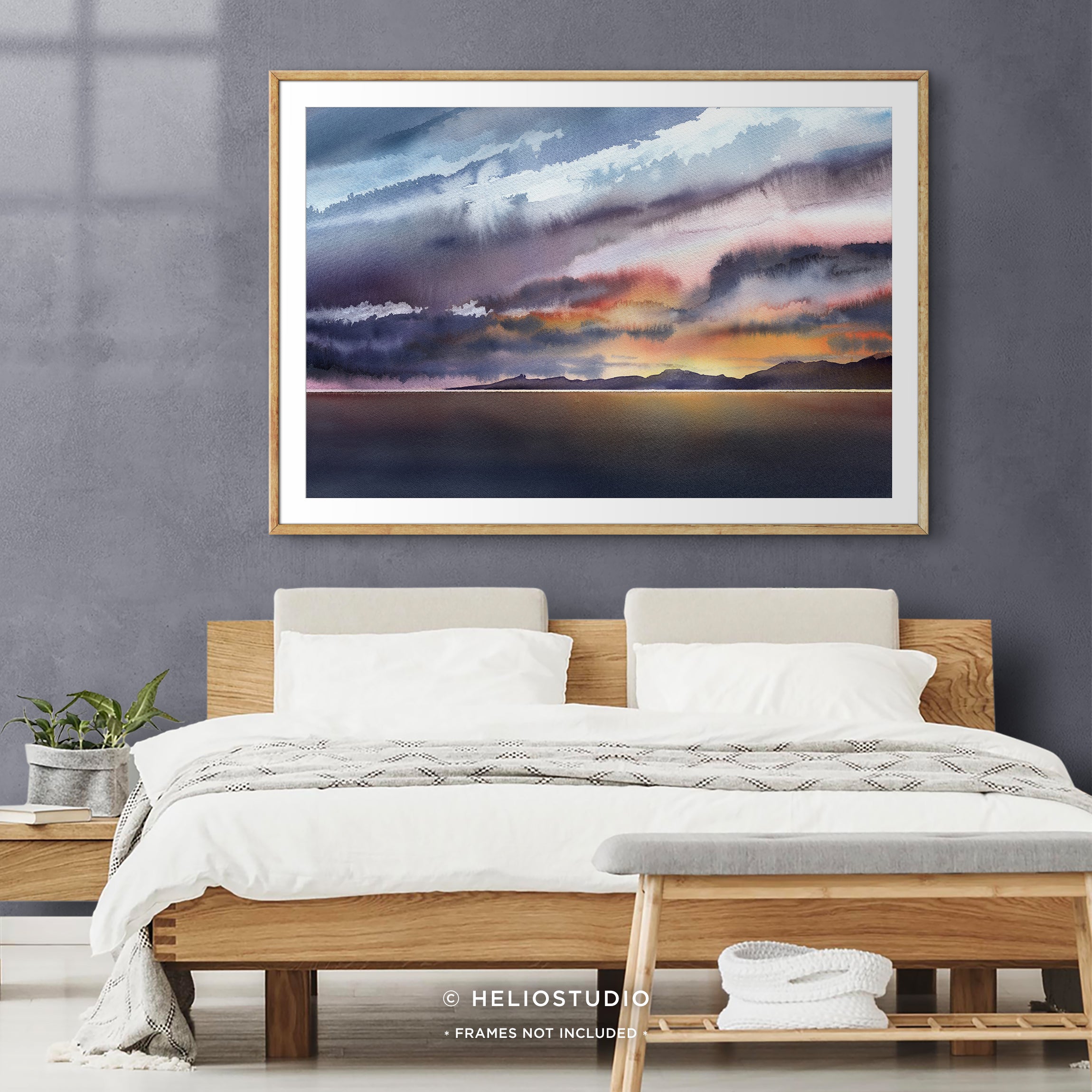 colourful watercolour sunset in wooden frame with white mount in boho bedroom