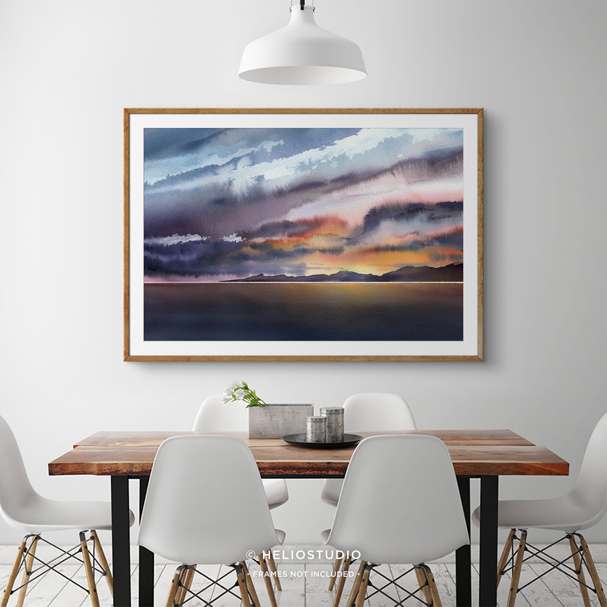 colourful watercolour sunset in wooden frame with white mount in sunny beach house dining room